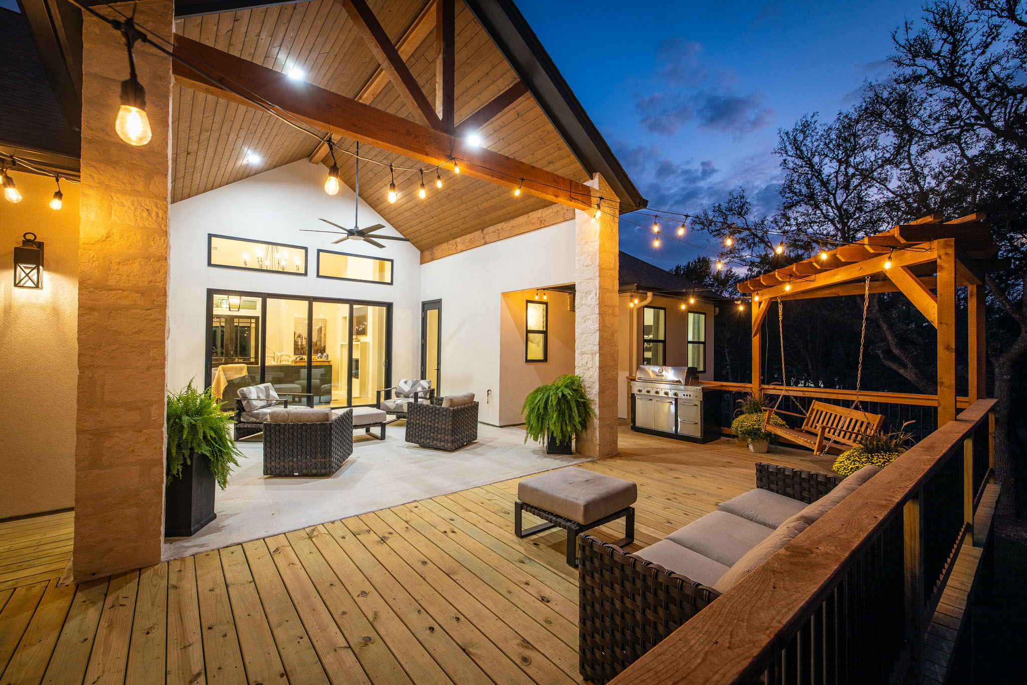 Covered outdoor living area with timber beams — Hearthside Homes Hill Country